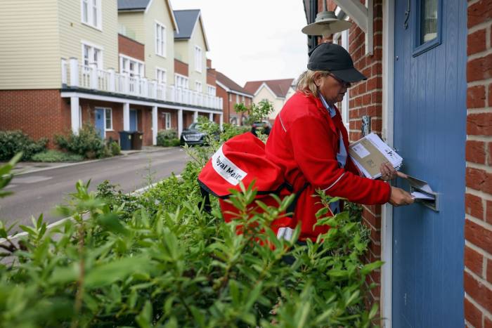A Royal Mail employee is delivering the job in Chelmsford