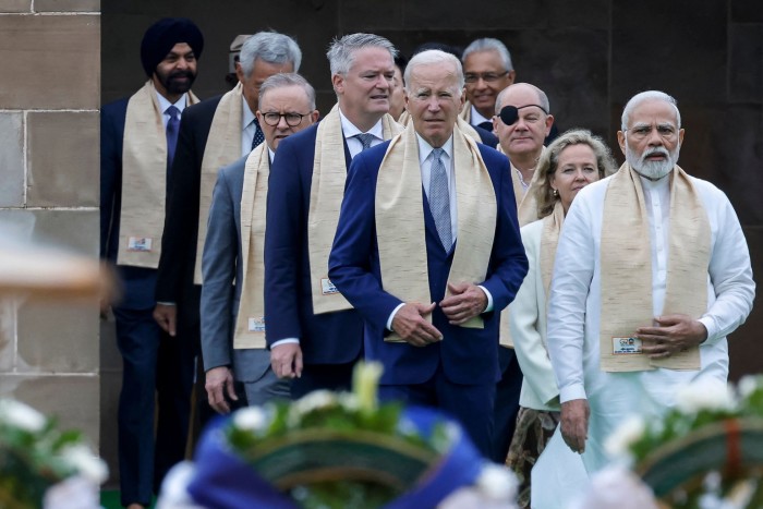 Indian prime minister Narendra Modi, right, and other world leaders visit the Mahatma Gandhi memorial in New Delhi