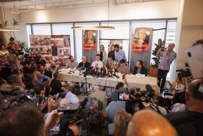 Family members and representatives of Israelis kidnapped by Hamas militants speak at a news conference on Tuesday