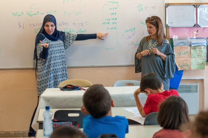 Teachers at the Hand in Hand school in Jerusalem give a class in Hebrew and Arabic